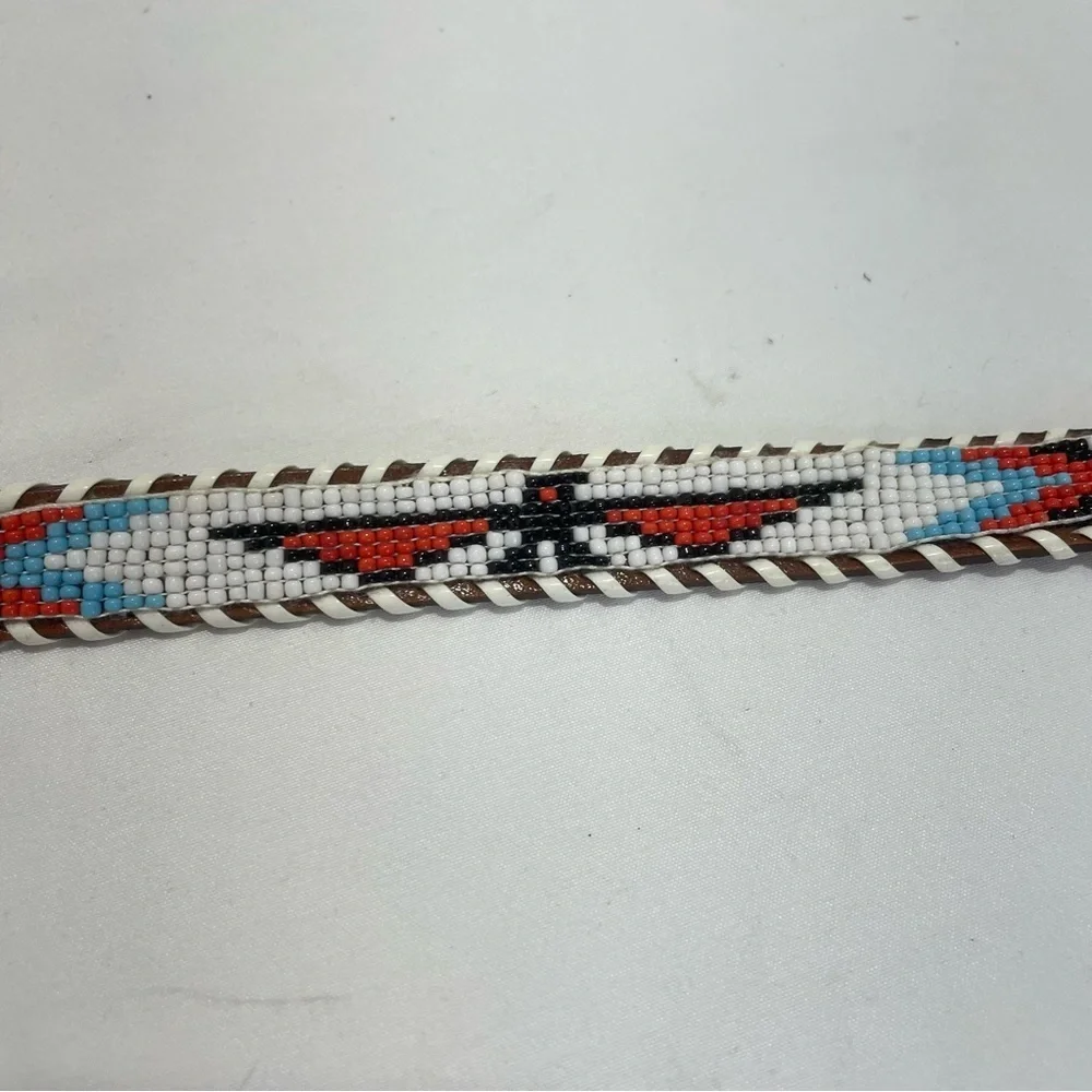 Child’s brown tribal beaded belt. Braided edge. Size 28. Pre-owned. Eagle. Arrow